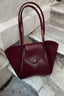 Sac en cuir bordeaux large avec pochette de maquillage
