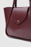 Sac en cuir bordeaux large avec pochette de maquillage