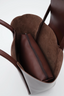Sac en cuir bordeaux large avec pochette de maquillage